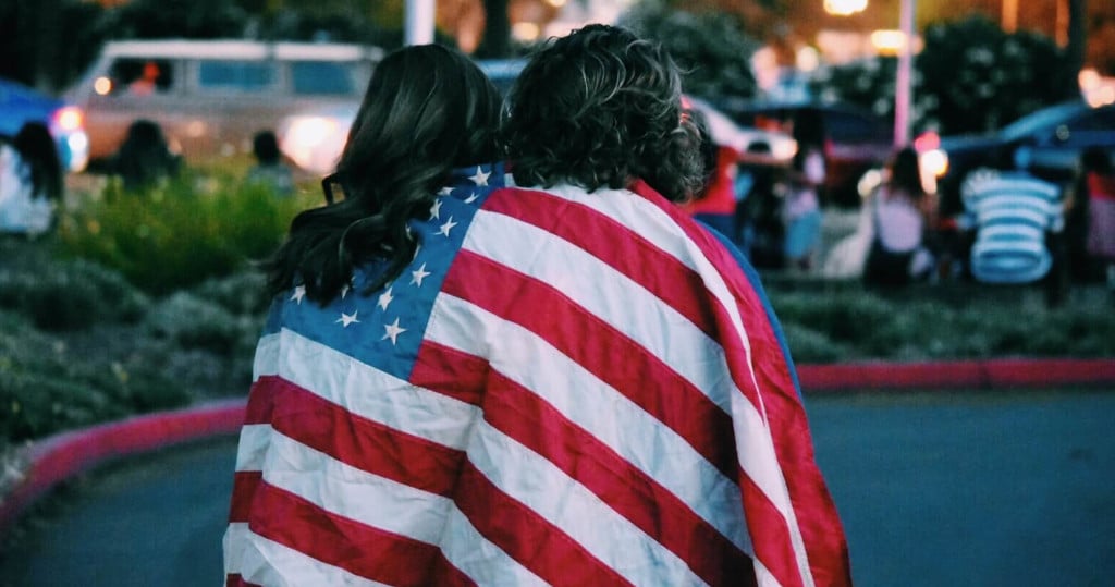 Couple draped in US flag