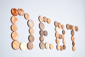 Coins spelling out debt