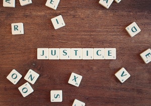 Photo of tiles spelling justice