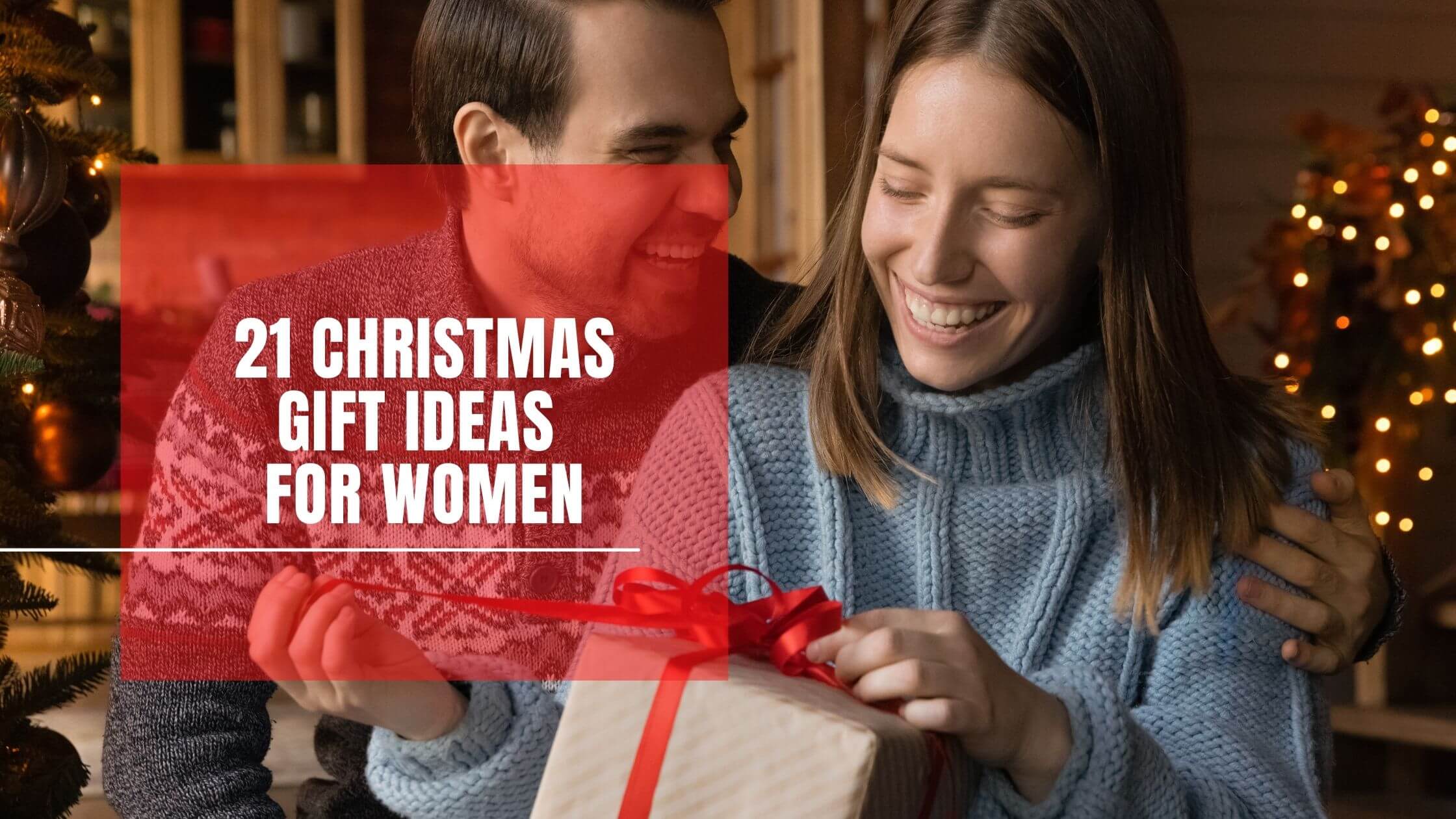 Woman unwrapping Christmas present