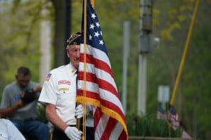 Veteran carrying United States flag