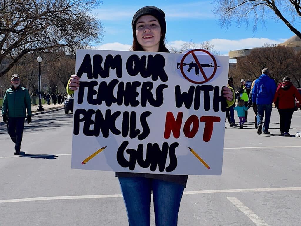 Woman holding protest sign