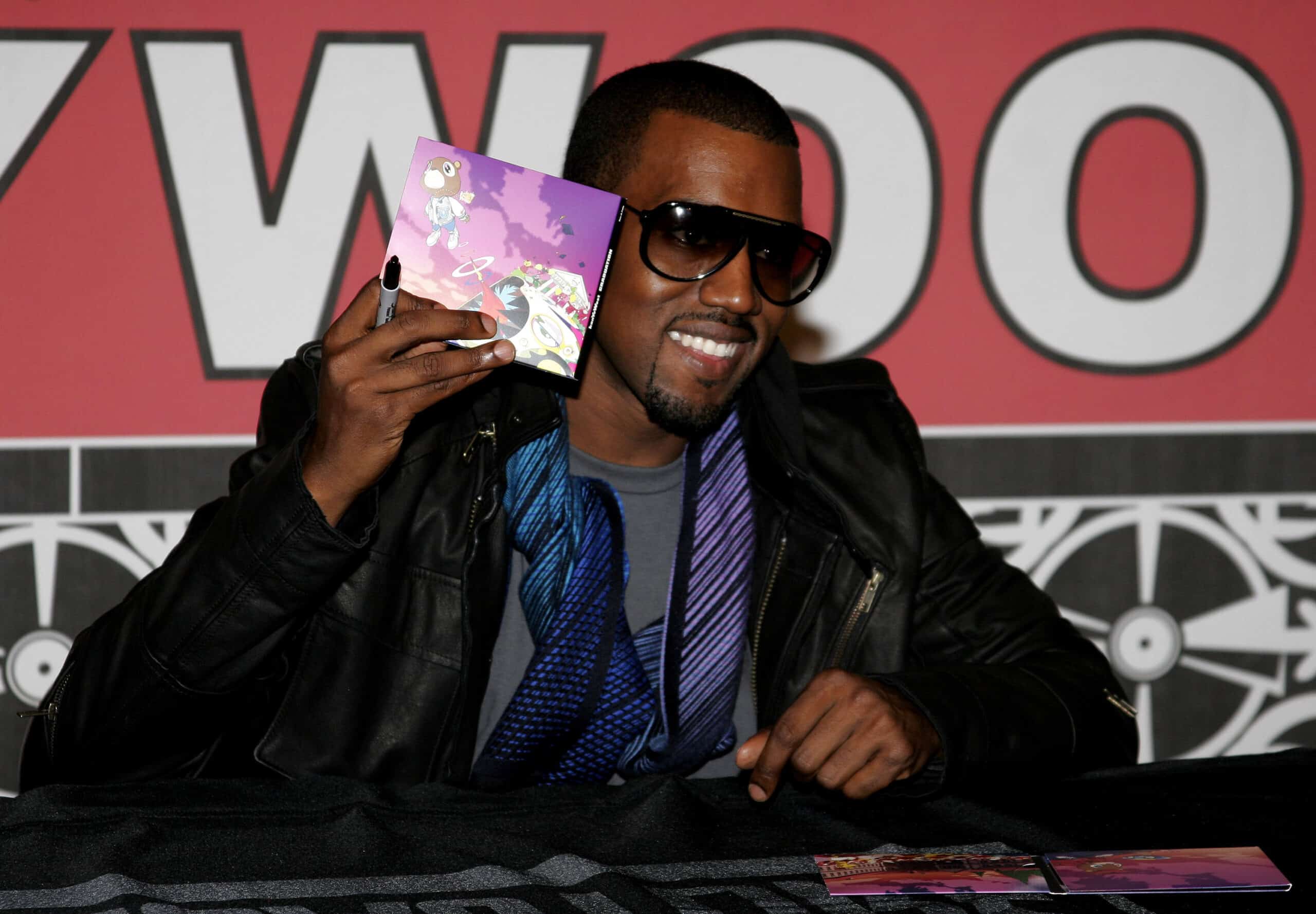 Kanye West holding his CD