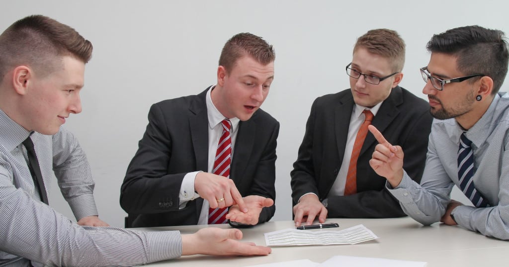 four men arguing