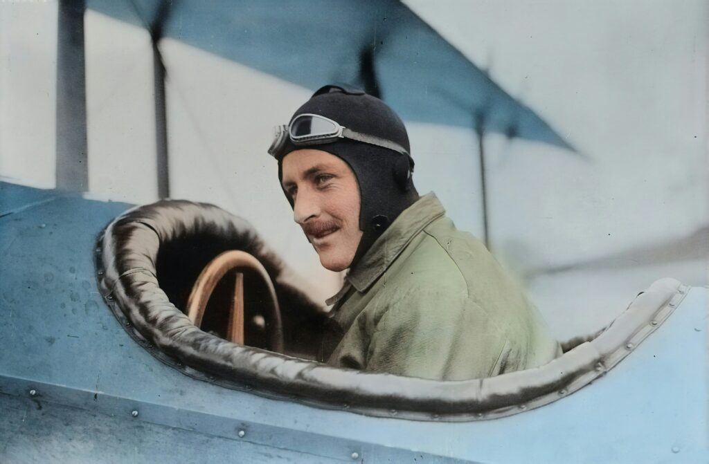 A pilot wearing a leather helmet and goggles sits in the cockpit of a vintage biplane, embodying a spirit that's as tough to amend as the Constitution itself.