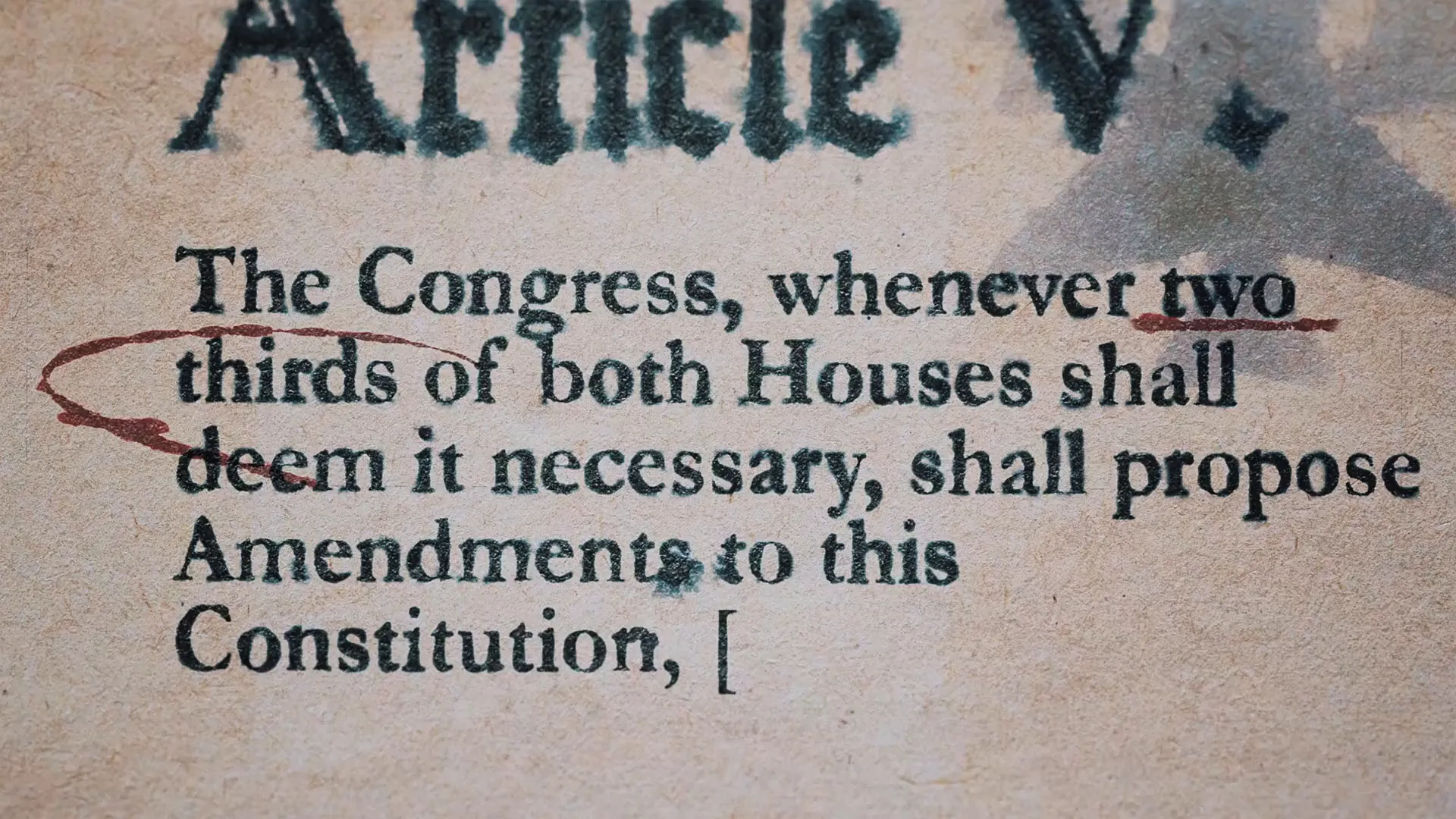 Close-up of text from the U.S. Constitution about Congress's ability to propose amendments, with editing marks highlighting "two thirds" and punctuation adjustments, ensuring democracy remains robust and true to the constitutional framework.